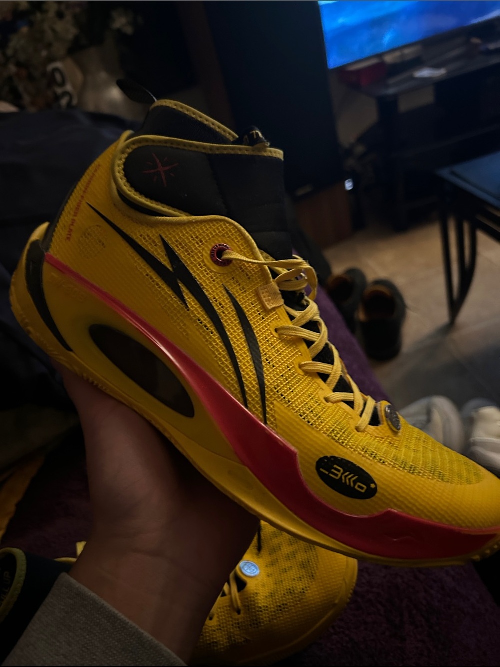 Men's Athletic Basketball Shoe in Yellow with Black and Pink Accents
